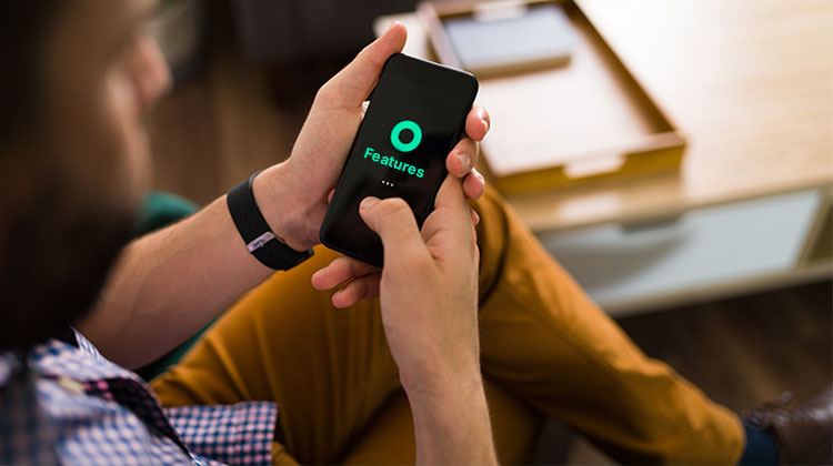 Man looking at a mobile app feature on his phone.